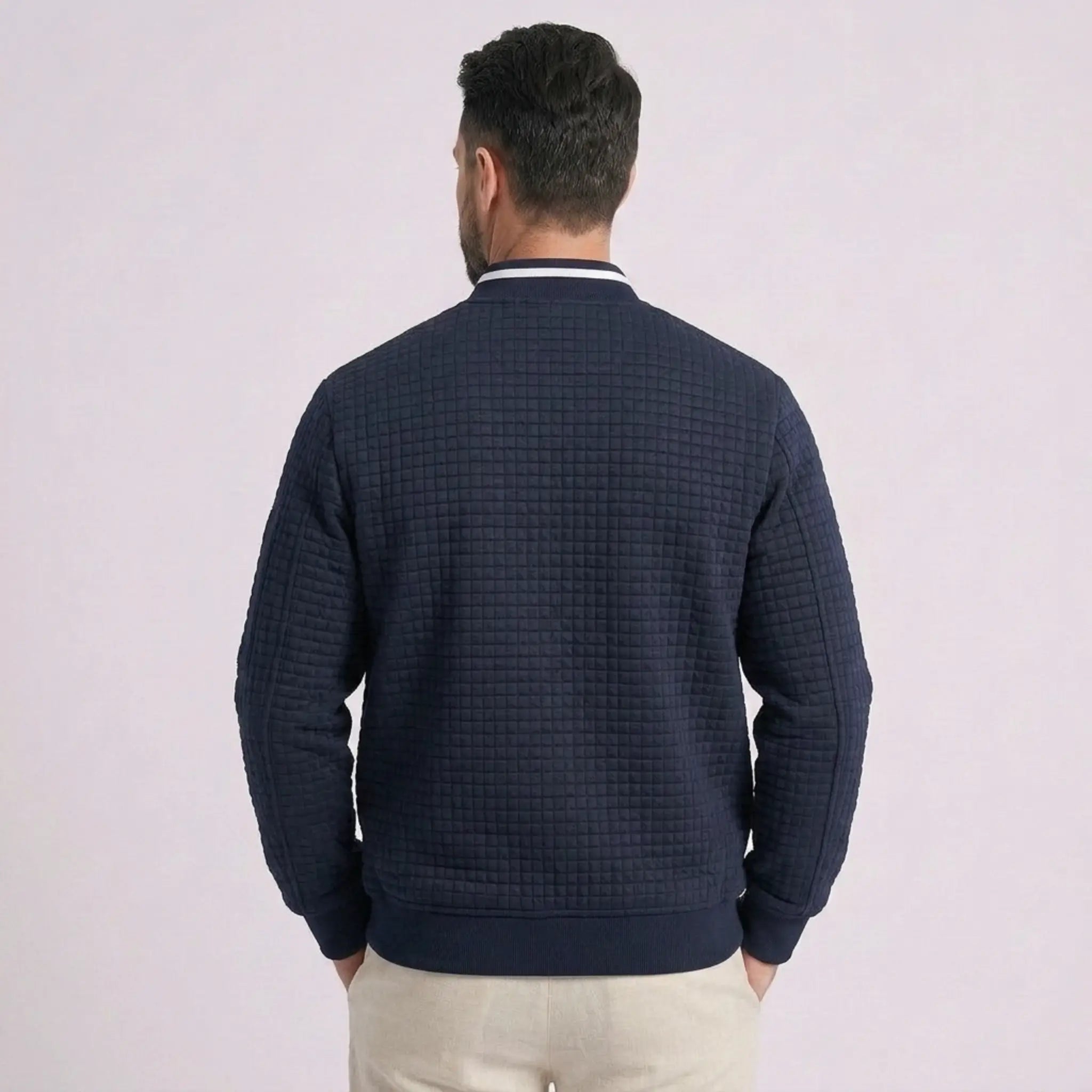 MannerCo navy quilted zip-up baseball jacket with stand collar, back view