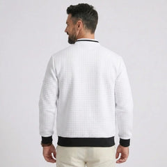 MannerCo white quilted zip-up baseball jacket with black collar and cuffs, back view