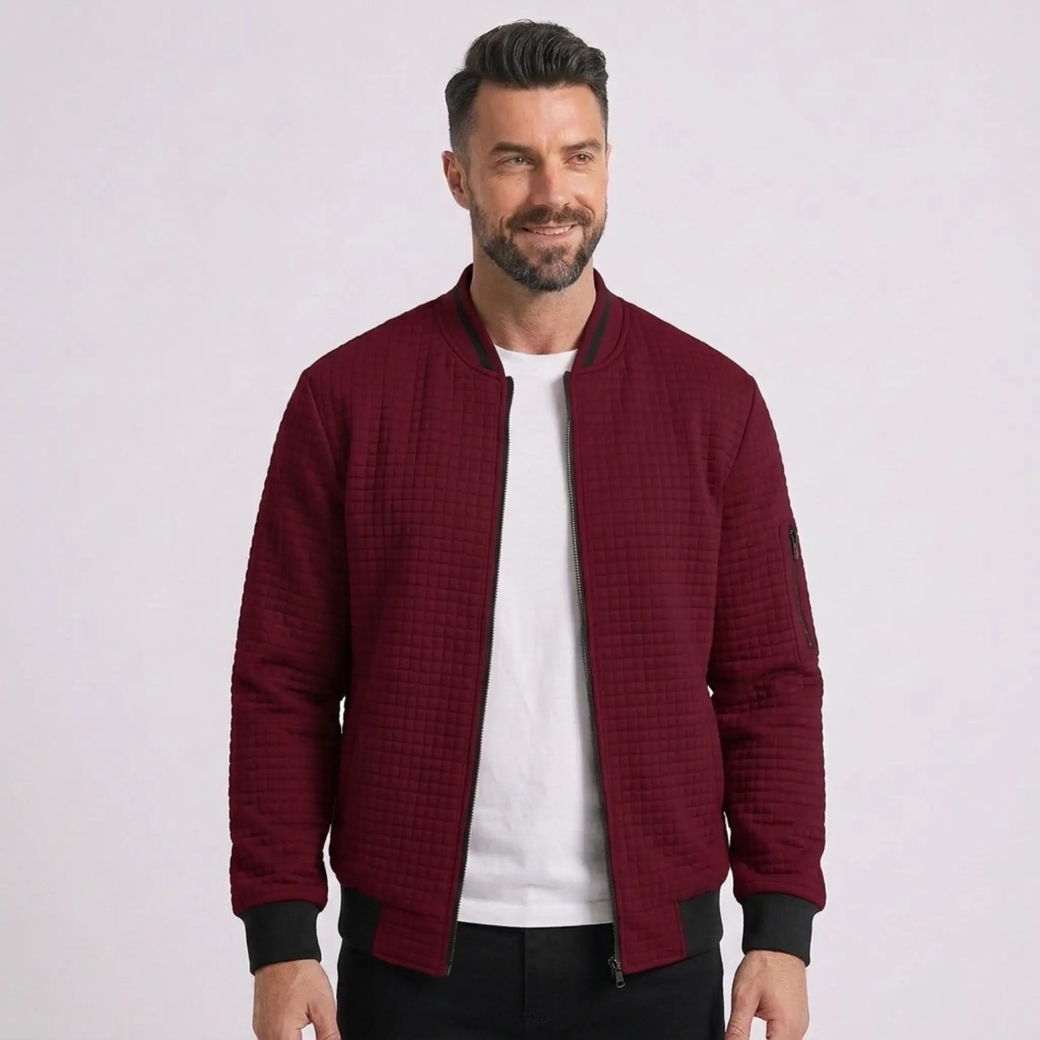 Man wearing MannerCo wine red quilted zip-up baseball jacket with stand collar, front view