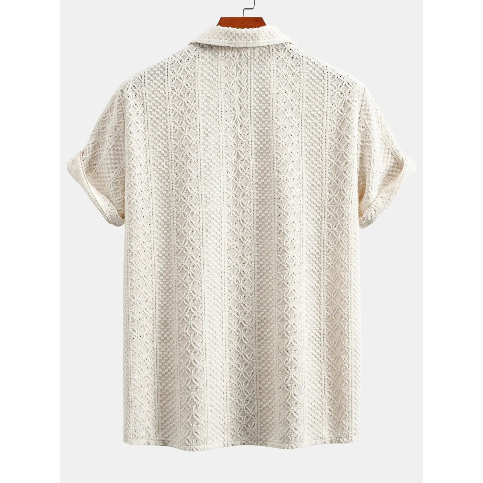 Full length view of man wearing beige checkerboard jacquard shirt and linen pants on neutral background