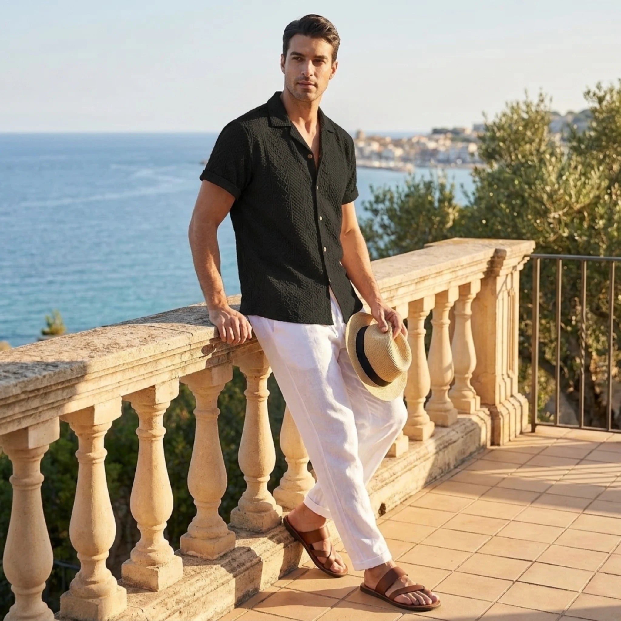 Man in beige floral checkerboard jacquard Cuban shirt and linen pants outdoor lifestyle scene