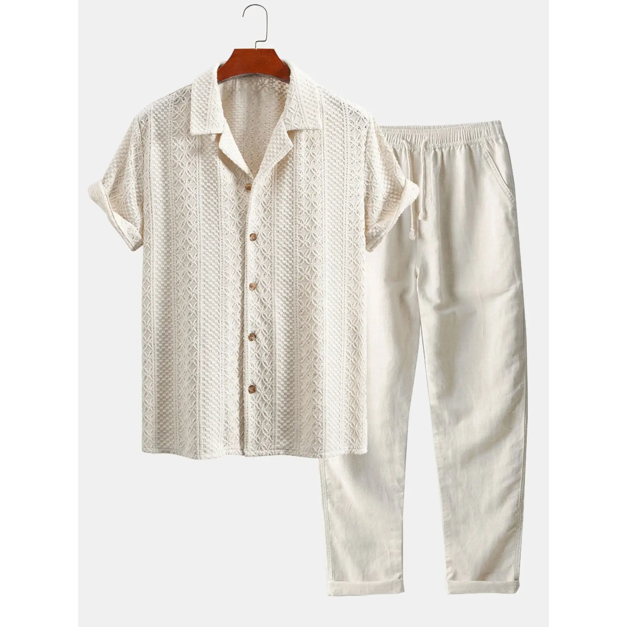 Close-up detail of beige floral checkerboard jacquard fabric texture on Cuban collar shirt