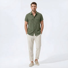 Man wearing beige linen rayon blend pocket utility shirt and straight leg linen pants front view