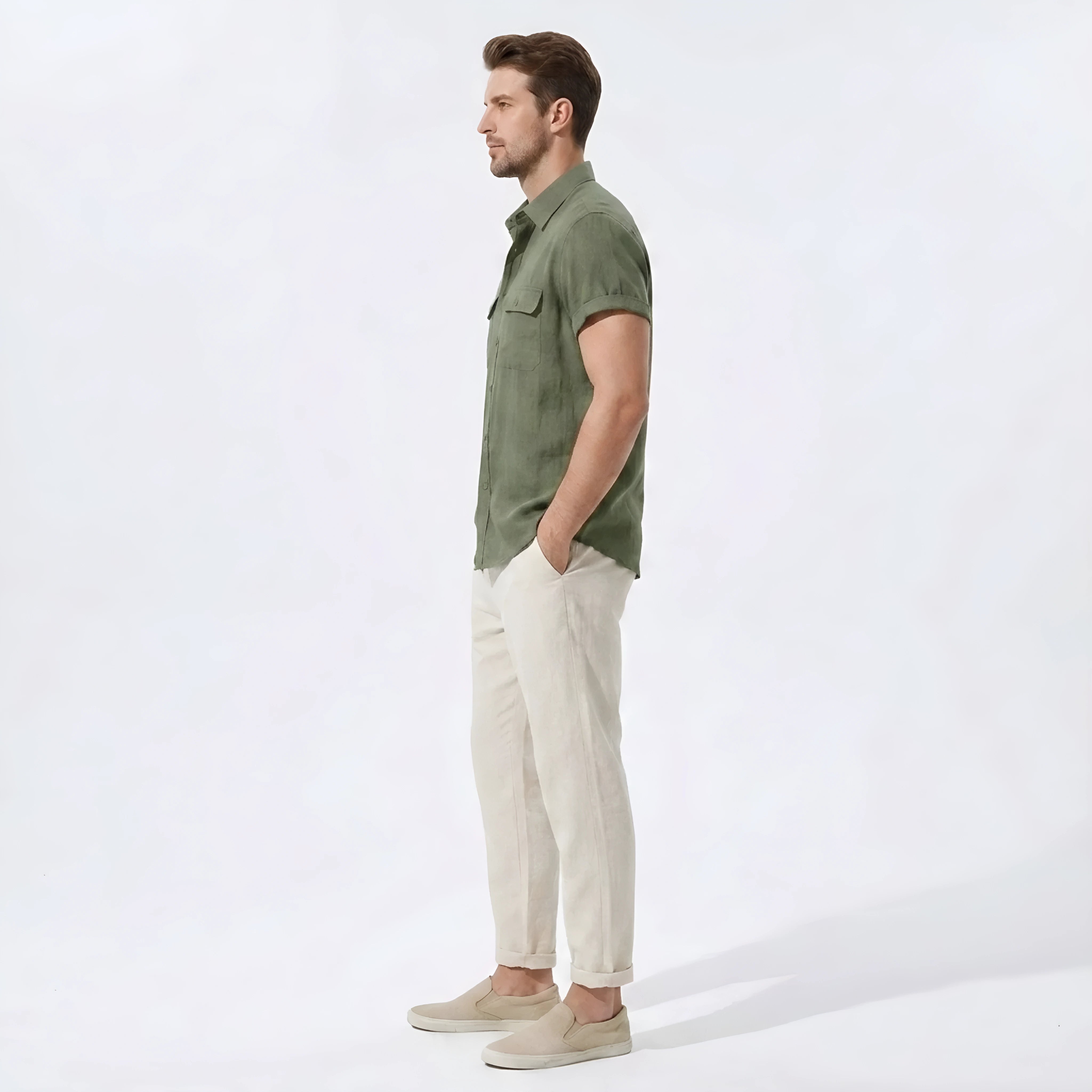 Side view of man in beige linen rayon blend utility shirt and straight leg linen pants