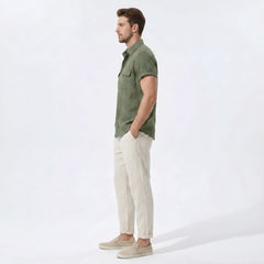 Side view of man in beige linen rayon blend utility shirt and straight leg linen pants
