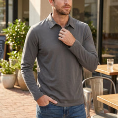 Man wearing a beige solid long sleeve cotton polo shirt front view on plain background