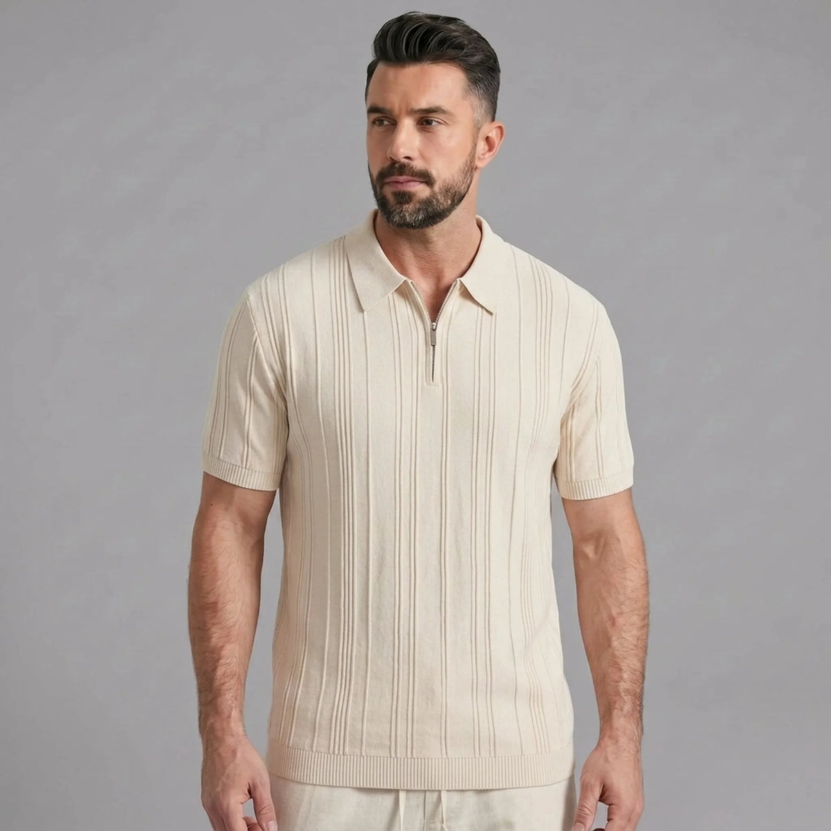 Man wearing a beige stripe jacquard knit zip-up polo shirt front view on plain background