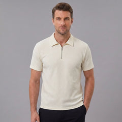 Man wearing a beige stripe jacquard zip-up polo shirt front view on plain background