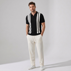 Man wearing beige striped knit Johnny collar polo and waffle pants in outdoor lifestyle setting