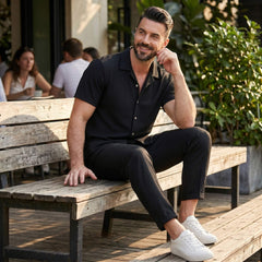 Man in beige waffle button up shirt and linen pants outdoor lifestyle scene