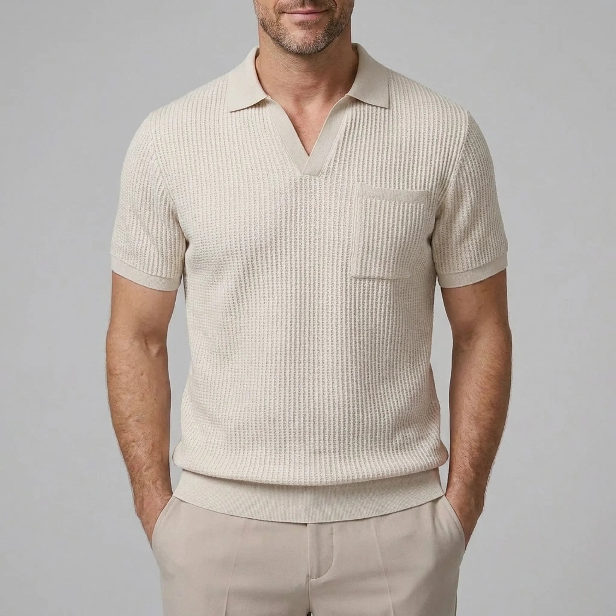 Back view of man wearing beige waffle johnny collar polo shirt and slim fit tapered pants