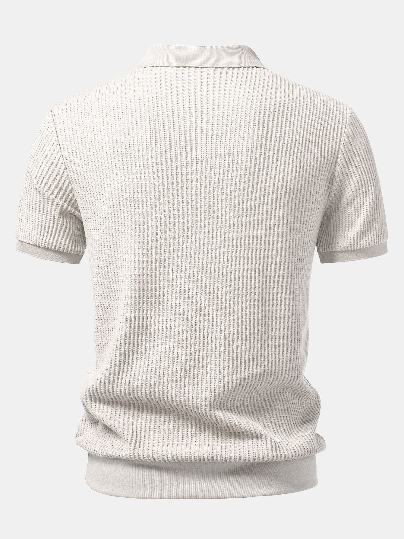 Man in beige waffle johnny collar polo and slim fit tapered pants in sunny outdoor scene