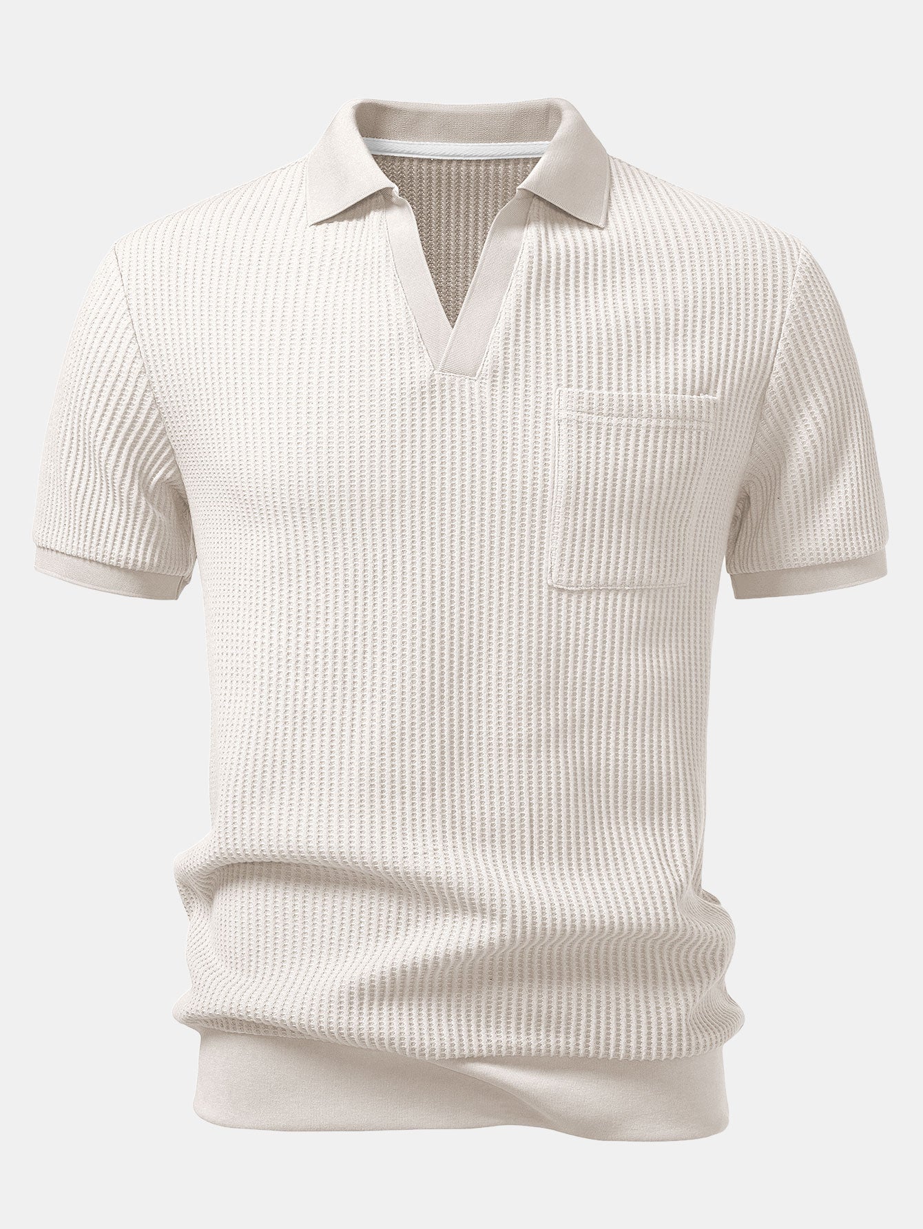 Man wearing beige waffle johnny collar polo shirt and slim fit tapered pants in outdoor lifestyle setting
