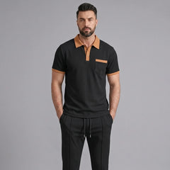 Man wearing a black color block waffle polo and straight leg pants front view