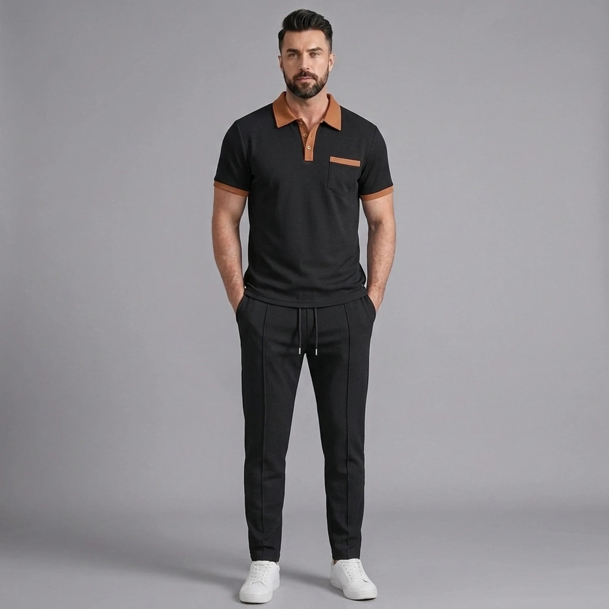 Side view of man in black color block waffle polo and straight leg pants