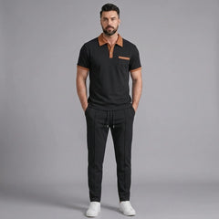 Side view of man in black color block waffle polo and straight leg pants