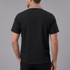 MannerCo black linen blend short sleeve shirt with contrast patterned collar, back view on model
