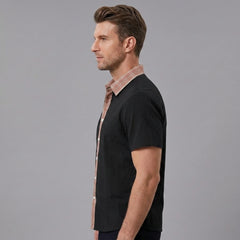 MannerCo black linen blend short sleeve shirt with contrast floral collar, side view on male model