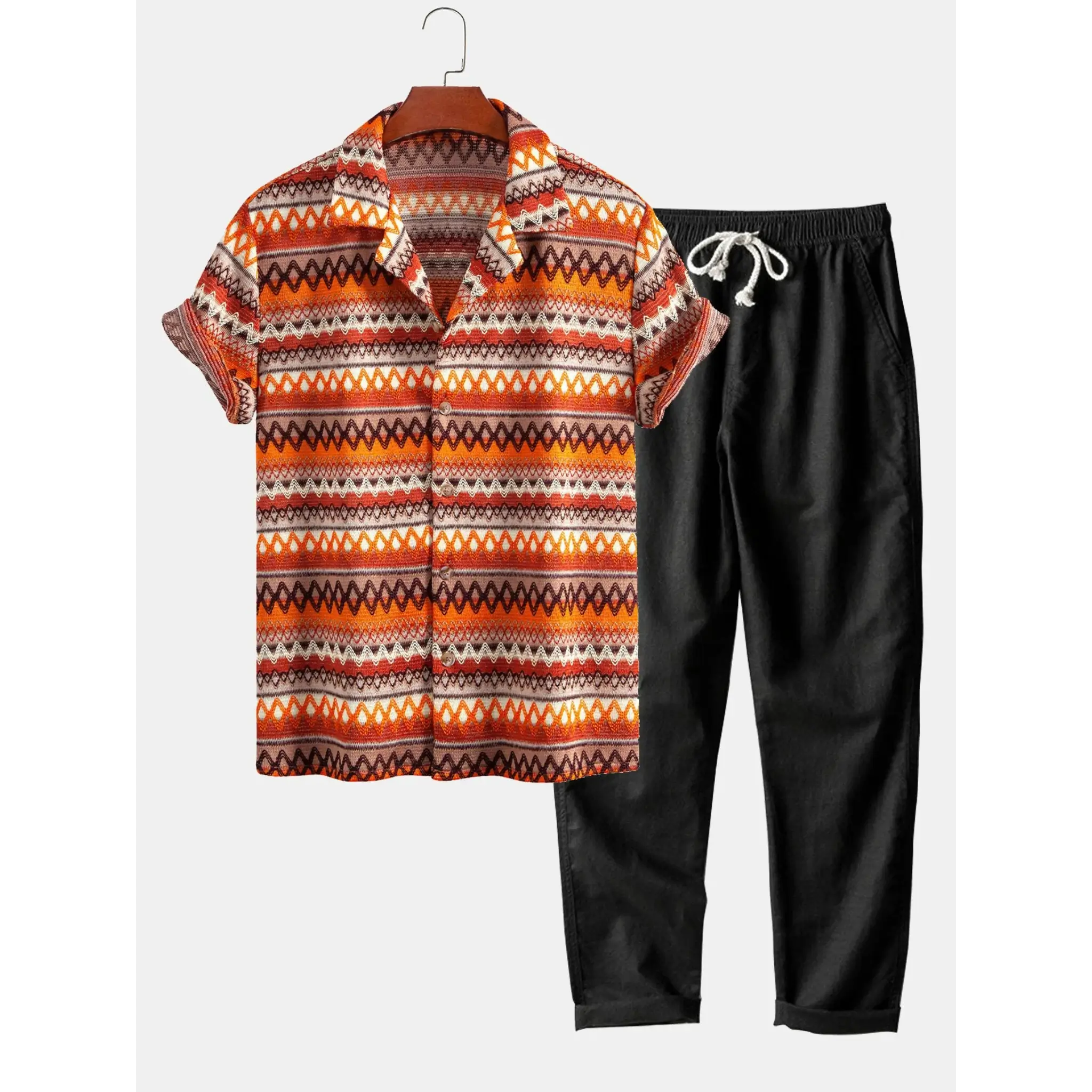 Patterned shirt and black pants on a white background