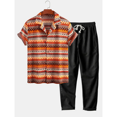 Patterned shirt and black pants on a white background