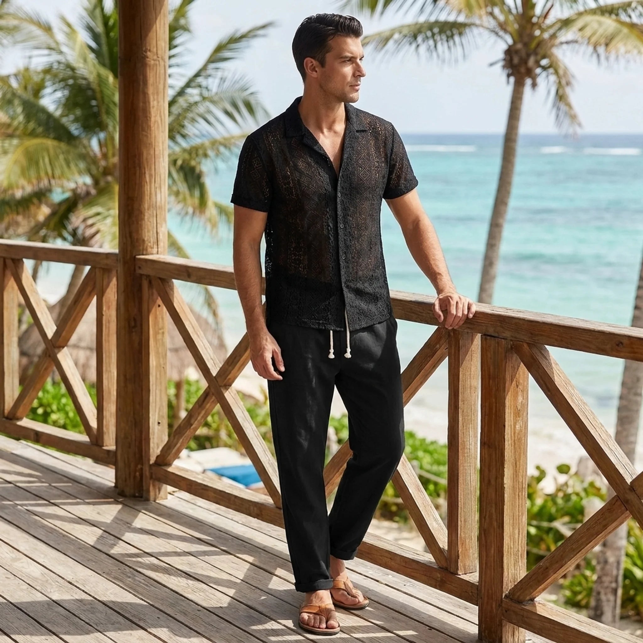 Man in black geometry textured Cuban shirt and linen pants walking in sunny outdoor summer scene