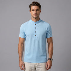 Man in black linen jacquard polo shirt in sunny outdoor scene