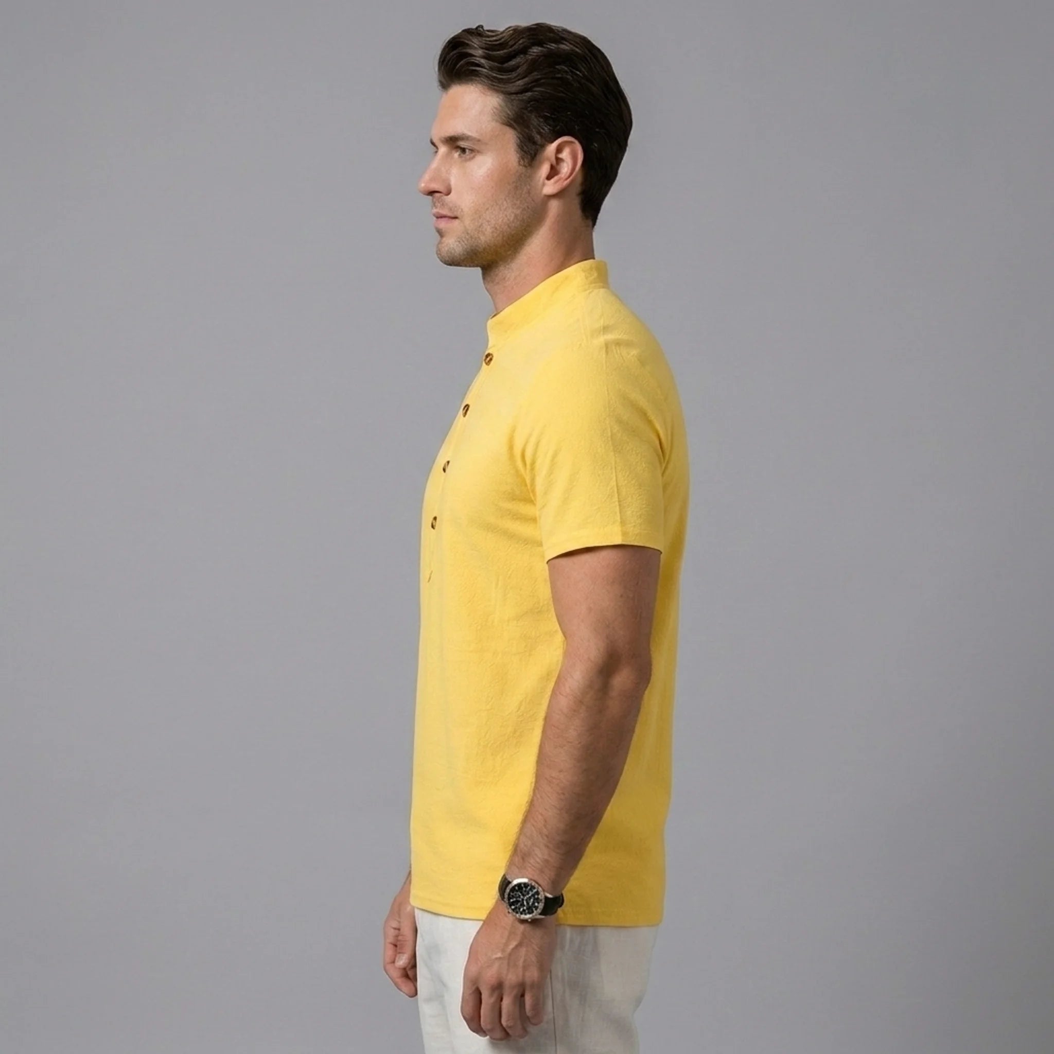 Side view of man in black linen jacquard short sleeve polo shirt