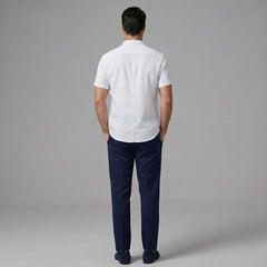 Back view of man wearing black linen look stand collar shirt and slim fit tapered trousers