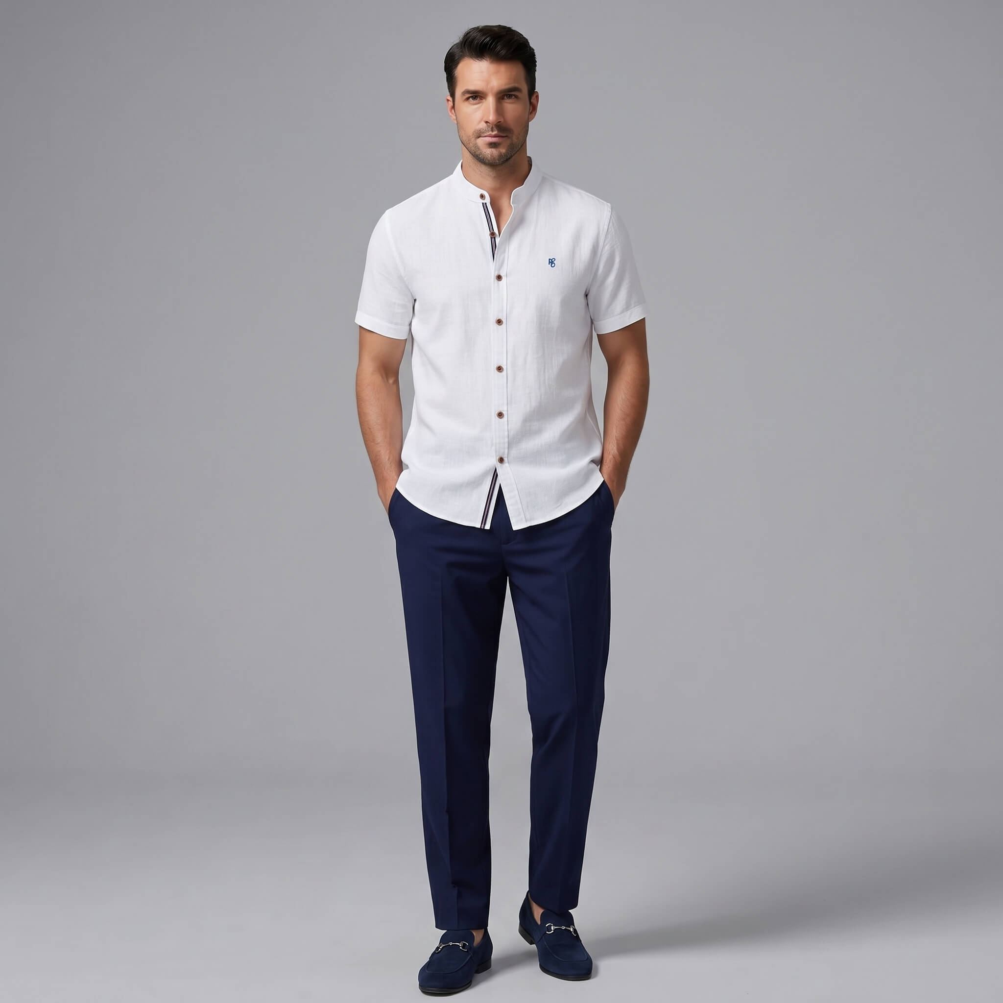 Man wearing a black linen look stand collar shirt and slim fit tapered trousers front view on plain background