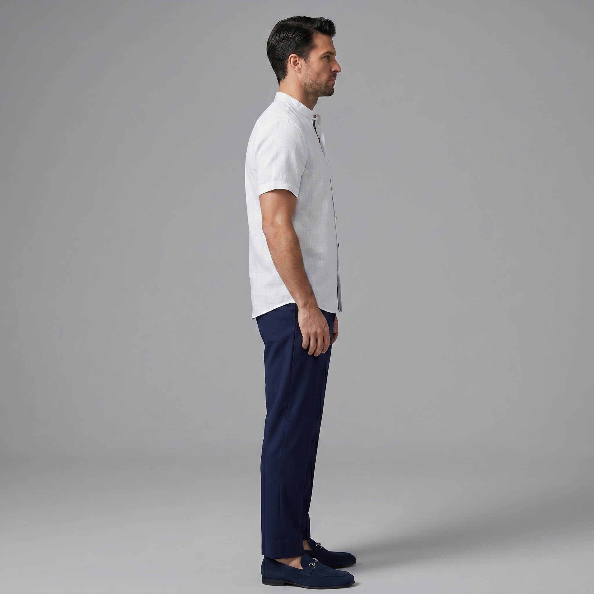 Side view of man in black linen look stand collar shirt and slim fit tapered trousers