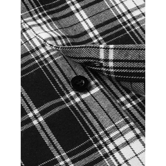 MannerCo black plaid lapel shirt detail showing button closure and woven check fabric