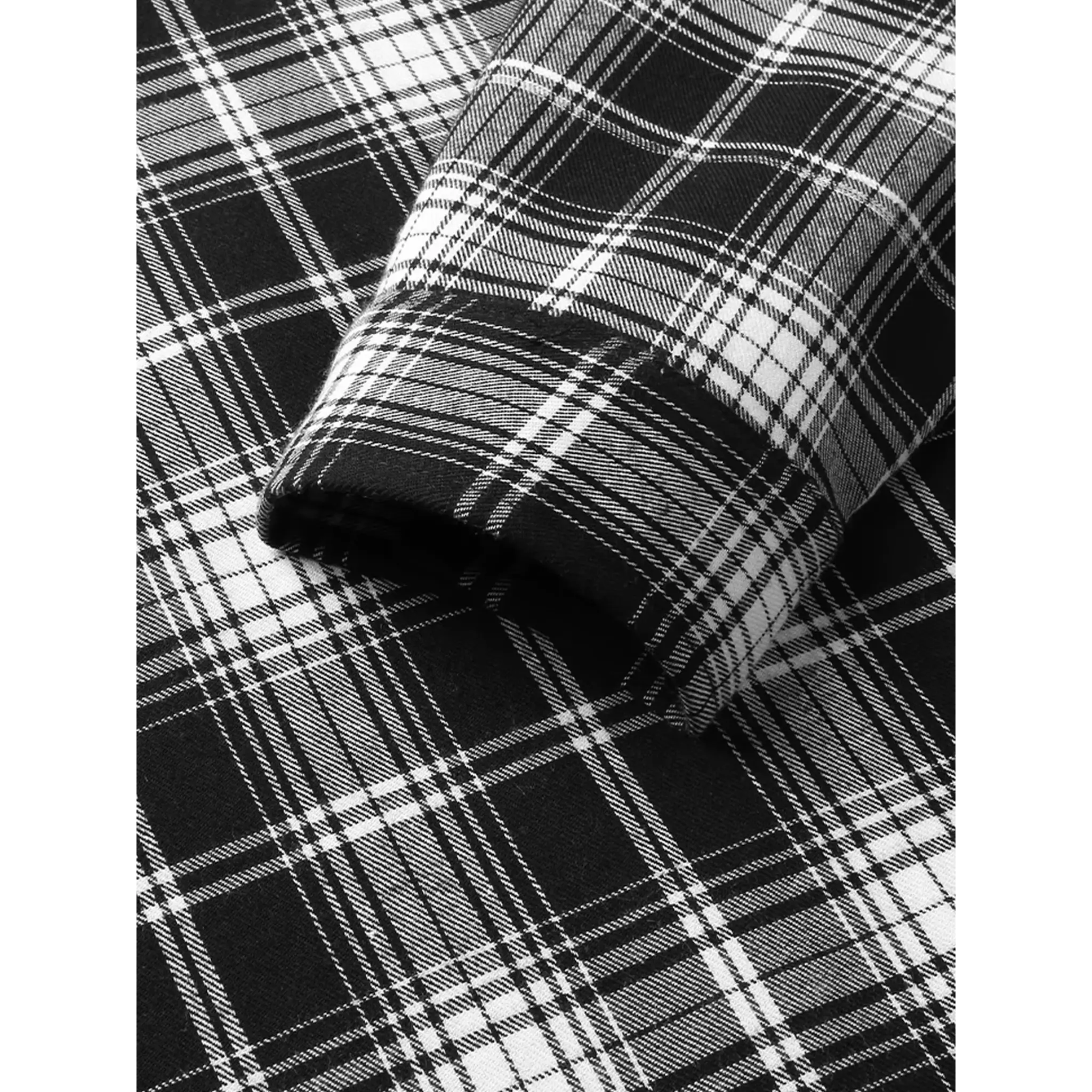 MannerCo black plaid lapel shirt fabric close-up showing tartan weave pattern and texture