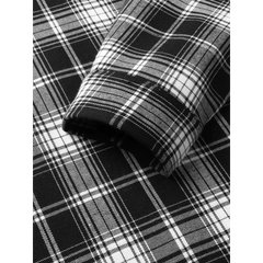 MannerCo black plaid lapel shirt fabric close-up showing tartan weave pattern and texture