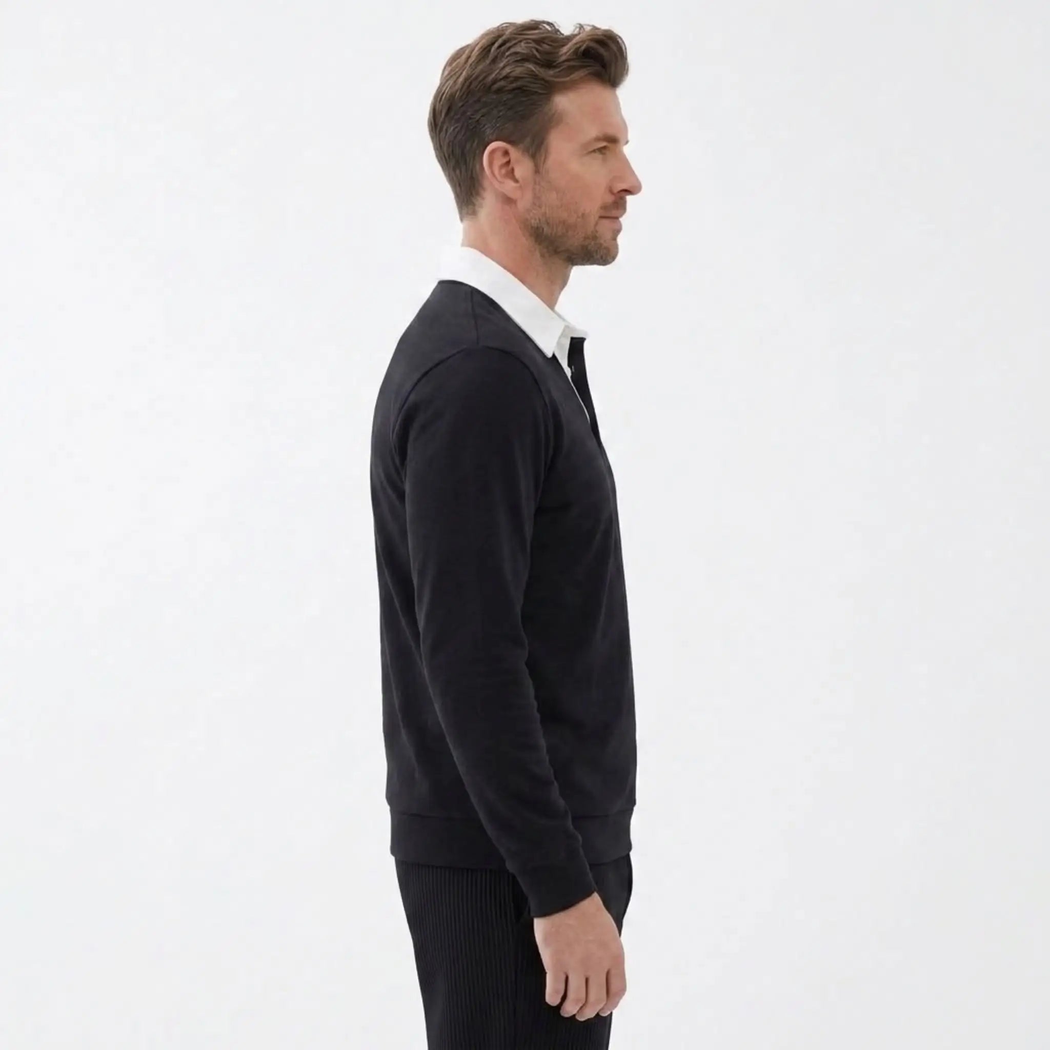 MannerCo black polo collar hoodie side view with white shirt collar detail