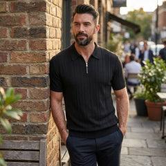 Back view of man wearing black stripe jacquard knit zip-up polo shirt