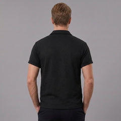 Back view of man wearing black stripe jacquard zip-up polo shirt