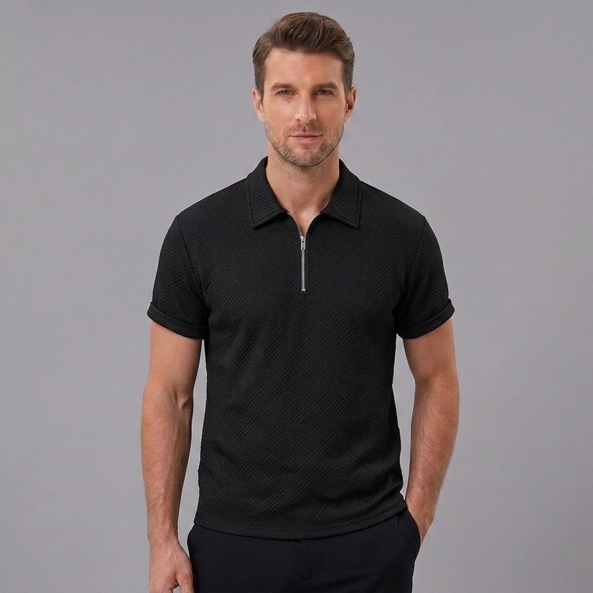 Man wearing a black stripe jacquard zip-up polo shirt front view on plain background