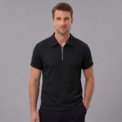 Man wearing a black stripe jacquard zip-up polo shirt front view on plain background
