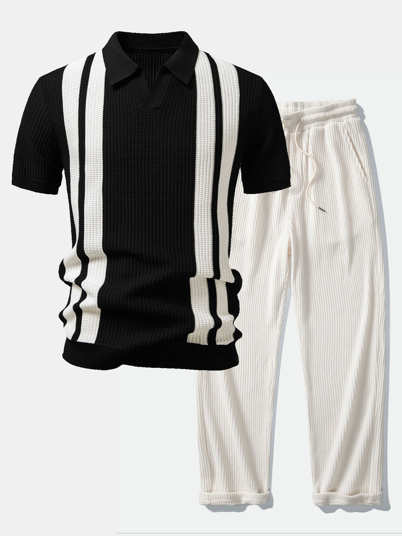 Man wearing a black striped knit Johnny collar polo shirt and waffle drawstring pants front view