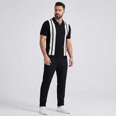 Man in black striped knit Johnny collar polo and waffle pants in sunny outdoor summer scene