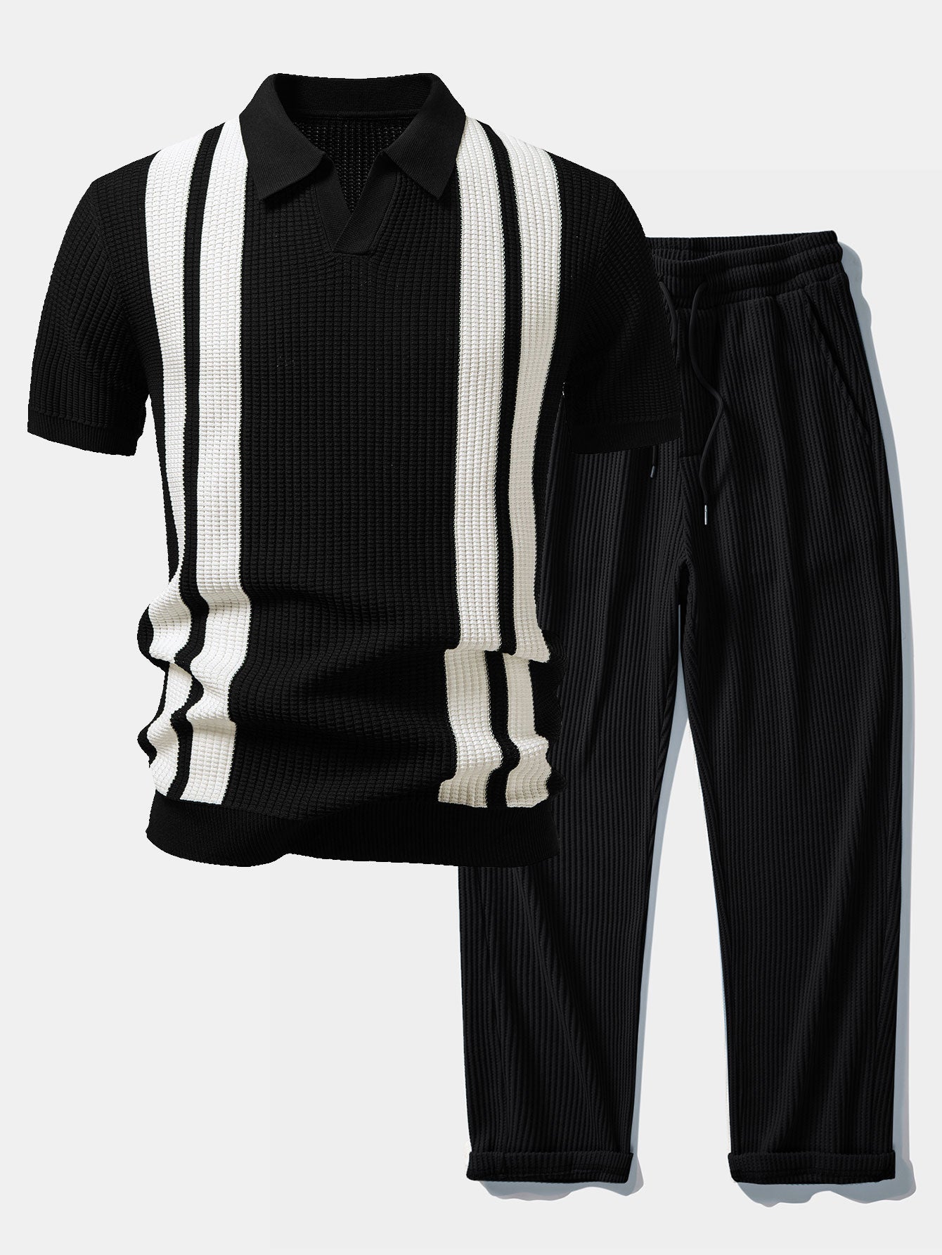 Man wearing black striped knit Johnny collar polo and waffle drawstring pants relaxed outdoor pose