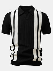 Man in black striped knit polo and waffle pants walking in outdoor summer scene