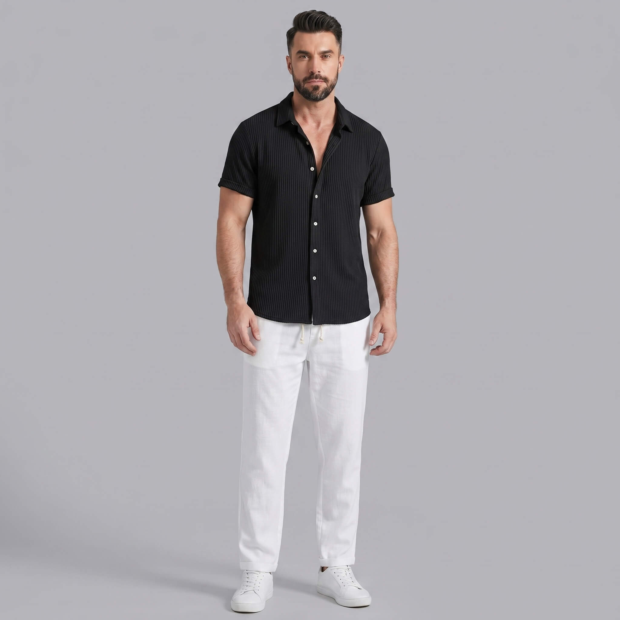 Man in black waffle shirt and linen pants in sunny outdoor summer scene