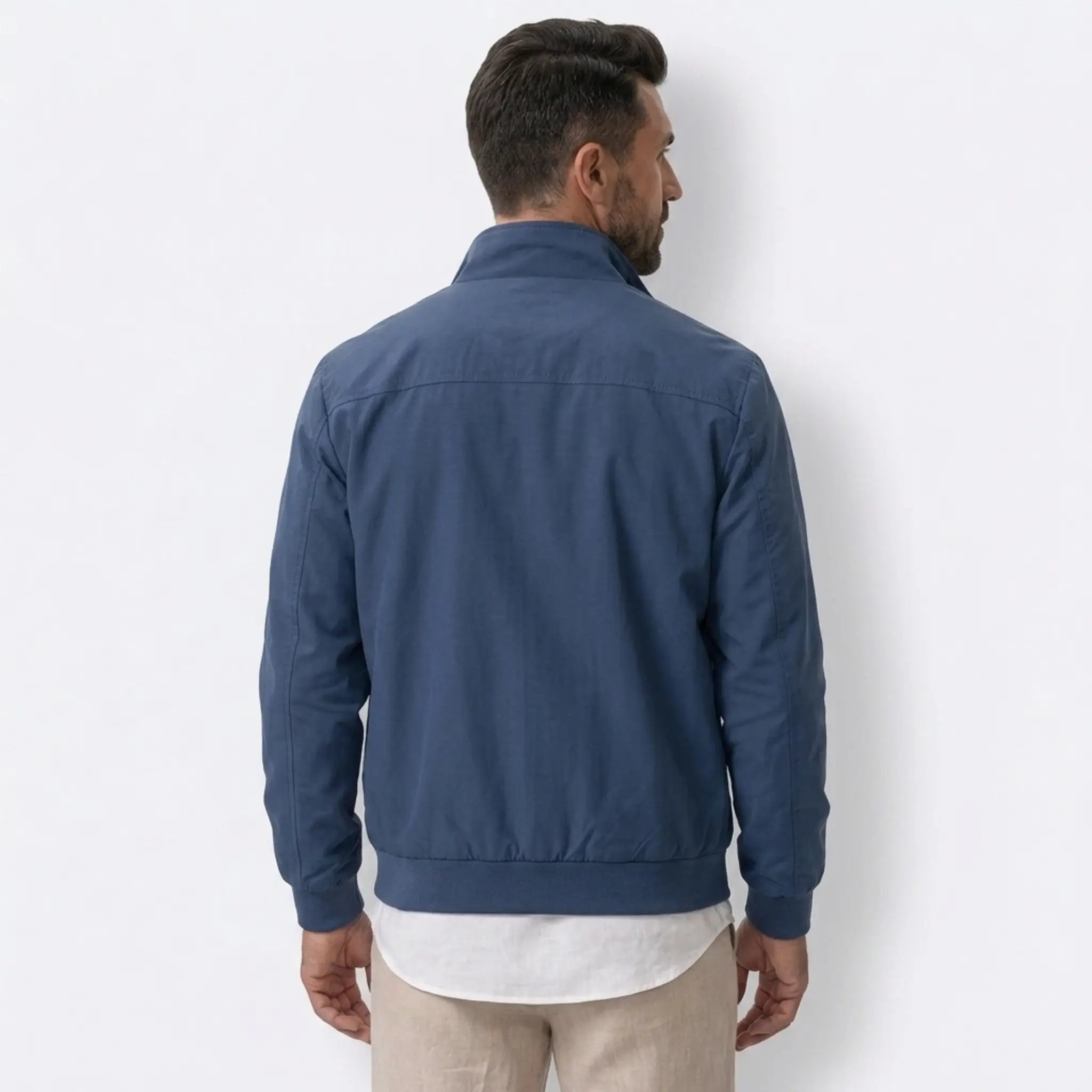 MannerCo blue solid bomber jacket back view with stand collar and ribbed hem