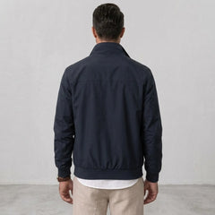 MannerCo blue solid bomber jacket back view with stand collar and ribbed hem