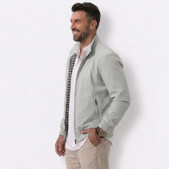 Man wearing MannerCo gray solid bomber jacket with stand collar and zip closure, front view