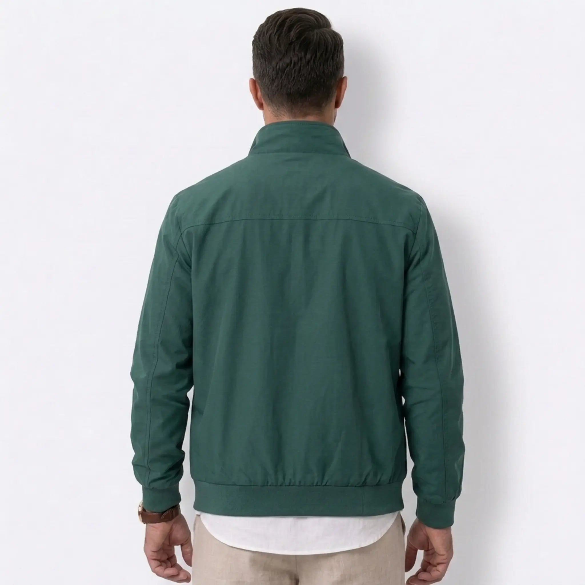 MannerCo green solid bomber jacket back view with stand collar and ribbed hem