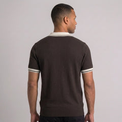 Back view of man wearing brown color block knit polo shirt with lapel collar