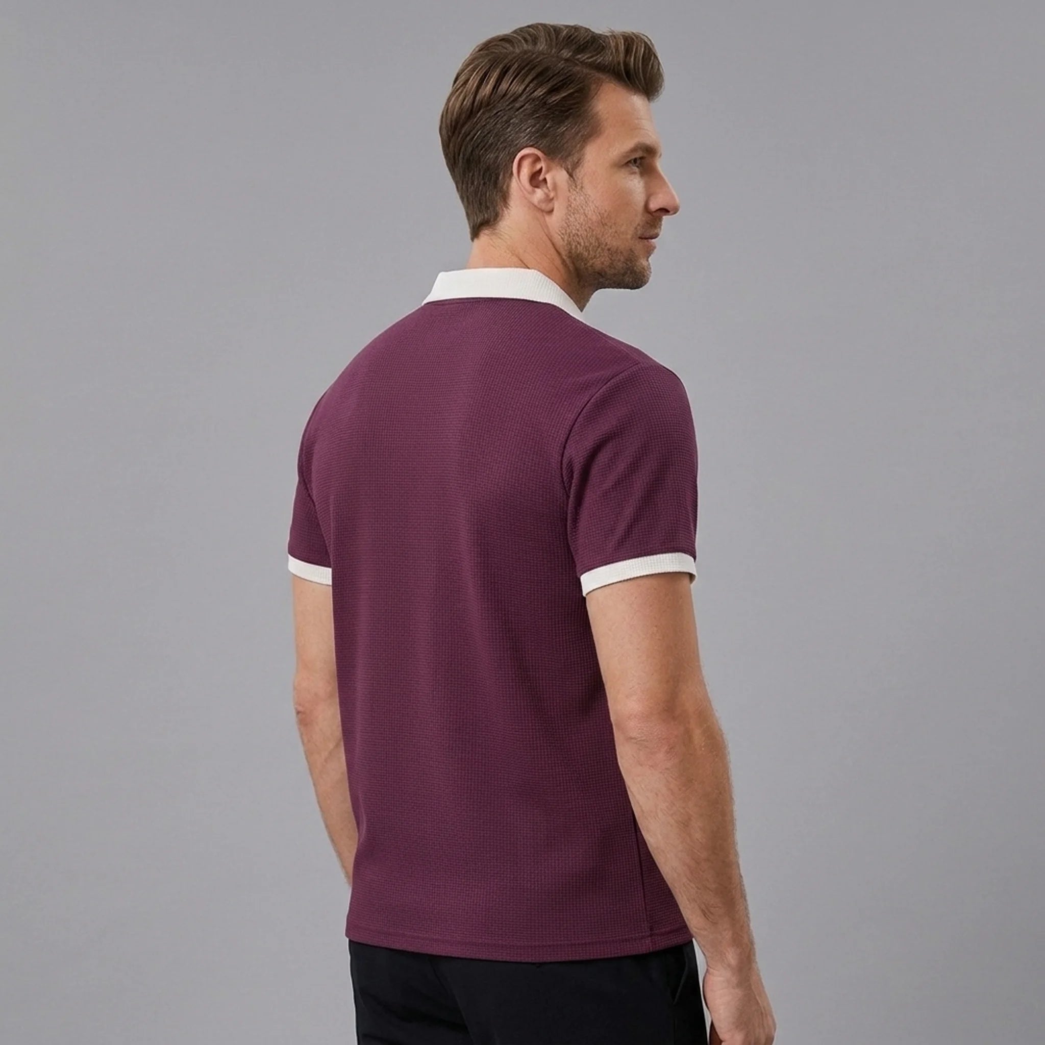 Back view of man wearing burgundy color block waffle polo shirt
