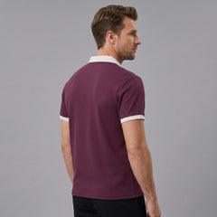 Back view of man wearing burgundy color block waffle polo shirt
